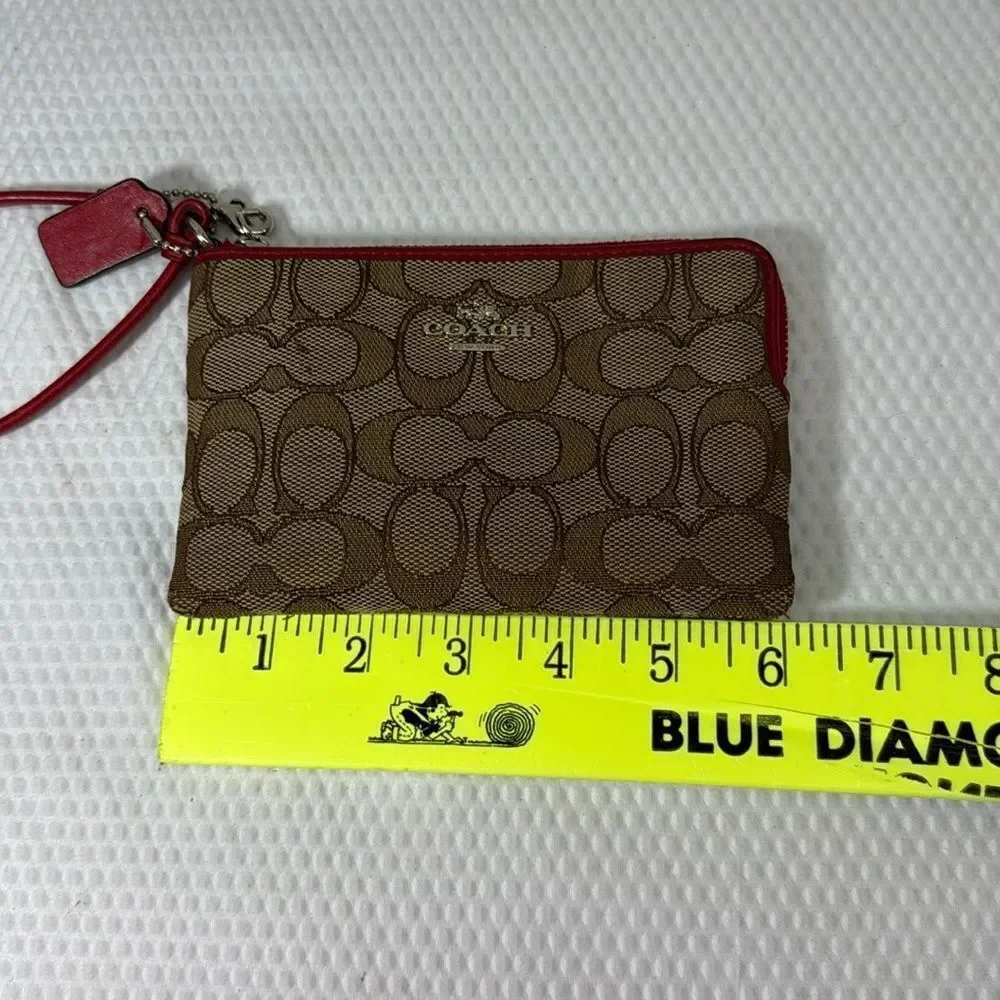 Coach tan and red Wristlet with Logo Pattern